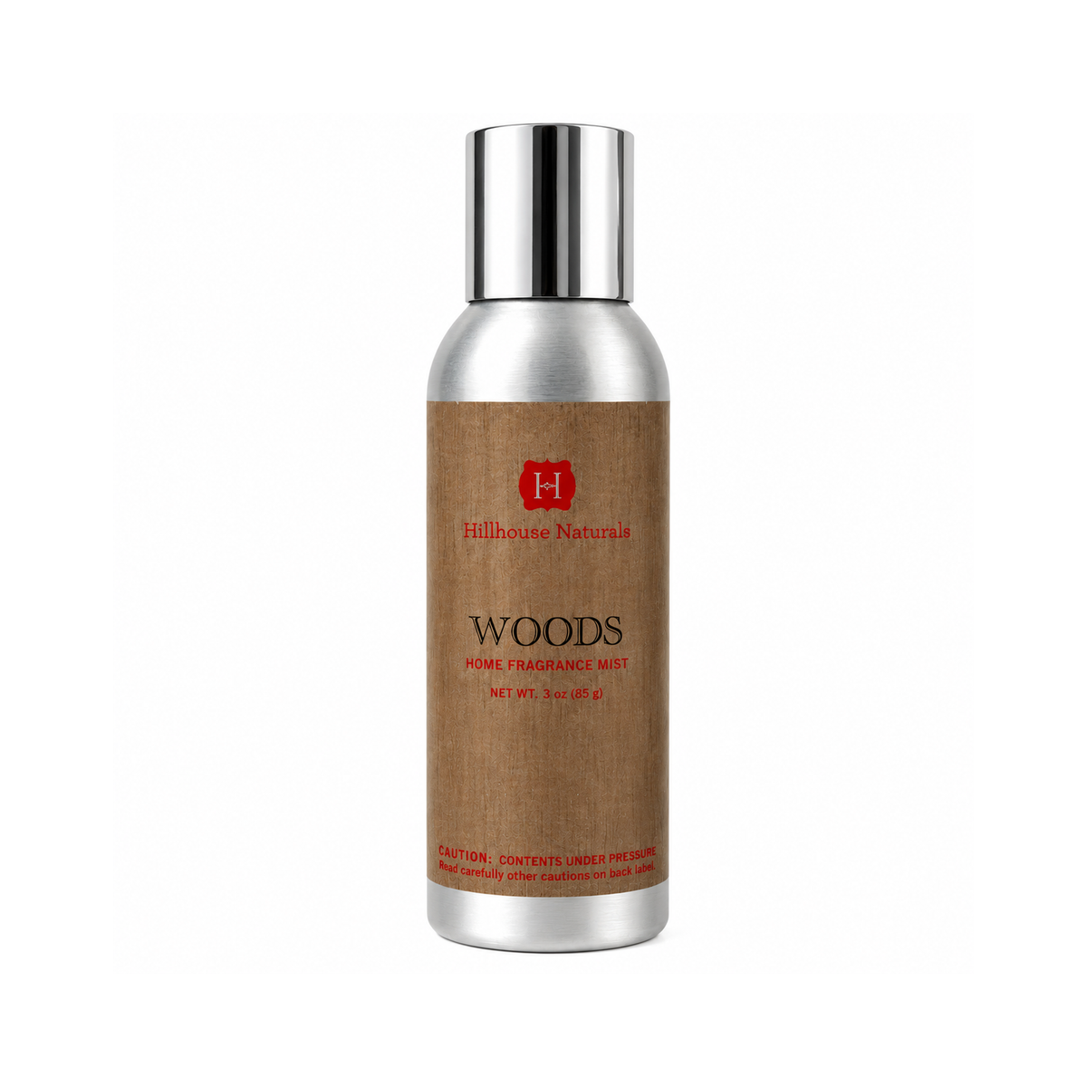 A silver cylindrical bottle of Hillhouse Natural Woods Home Fragrance Mist with a brown kraft-paper style label, set against a plain white background.